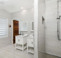 Bathers across the bay from Port Douglas - Tourism Caloundra